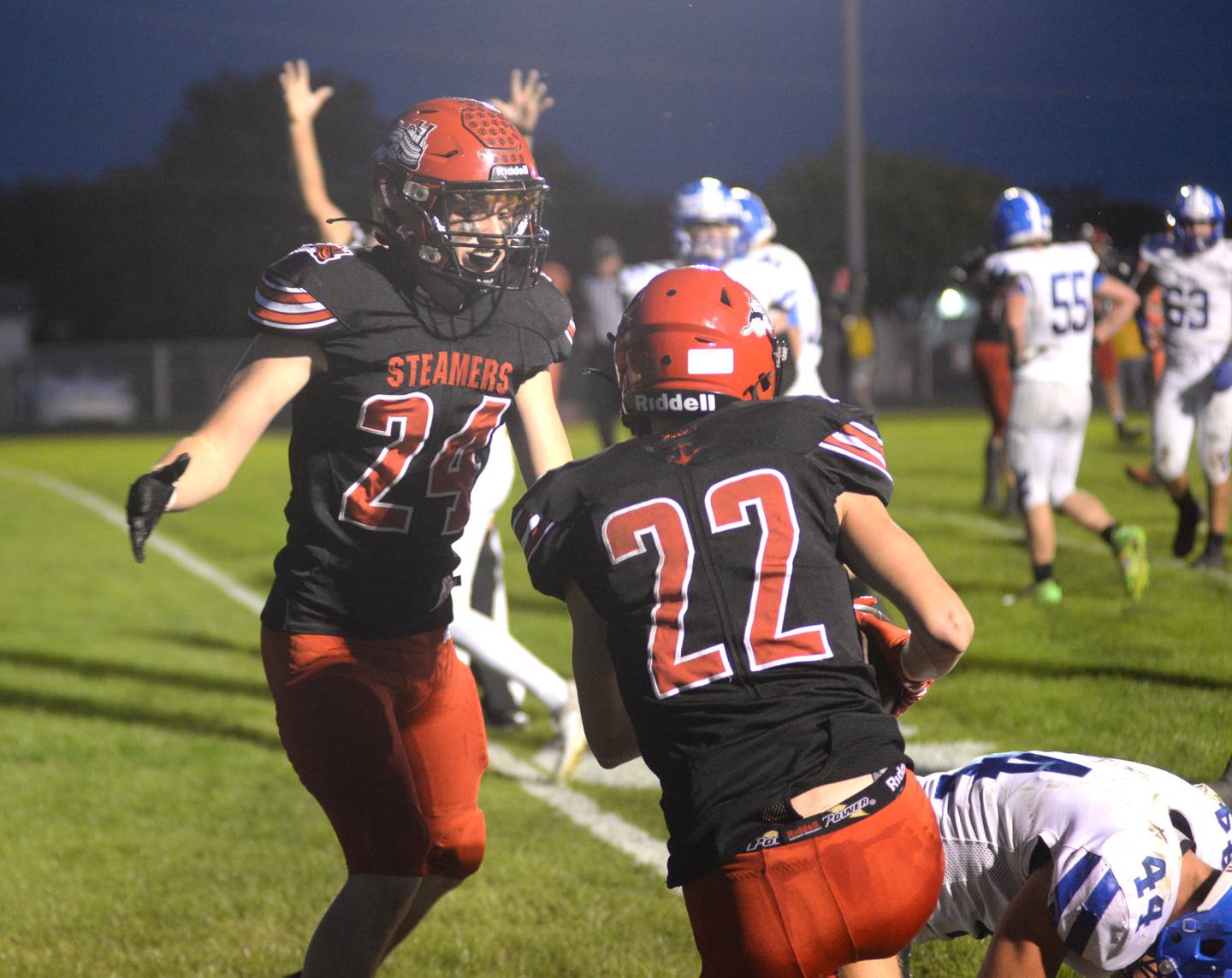 Fulton's Jimmy Crimmins (24) comes over to celebrate with Baylen Damhoff (22) after he caught a pass and powered his way into the end zone during Friday, Sept. 29, 2023 action against Galena at Fulton High School.