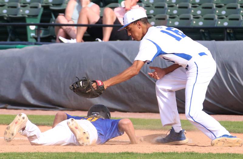 Newman's Isaiah Williams misses the tag on the throw back to first as Maroa-Frosyth'as Kaiden Maurer slides back into the plate safely during the Class 2A semifinal game on Friday, May 31, 2024 at Dozer Park in Peoria.