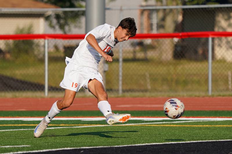 Oswego’s Lucas Ensign (19) shoots the ball for a goal against Yorkville during a soccer match at Yorkville High School on Tuesday, Sep 17, 2024.