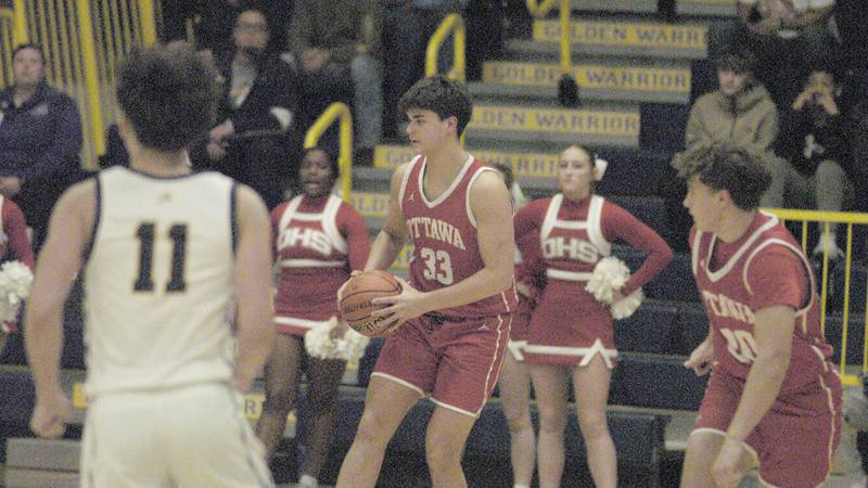 Ottawa's Aric Threadgill recovers a rebound  during Ottawa's 3A Regional semifinal game Wednesday, Feb. 21, 2024, at Sterling High School.