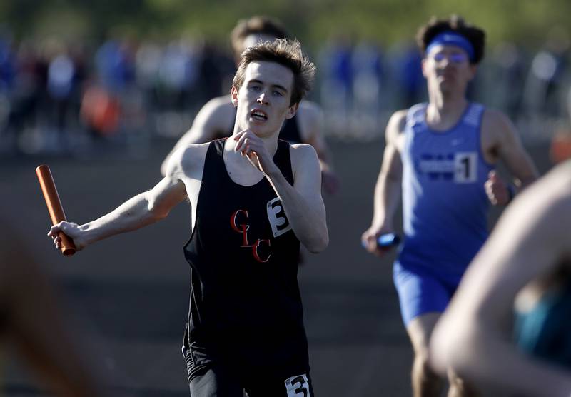 Crystal Lake Central’s James Durcan crosses the finish line in the 4x800 meter relay Friday, April 21, 2023, during the McHenry County Track and Field Meet at Cary-Grove High School.