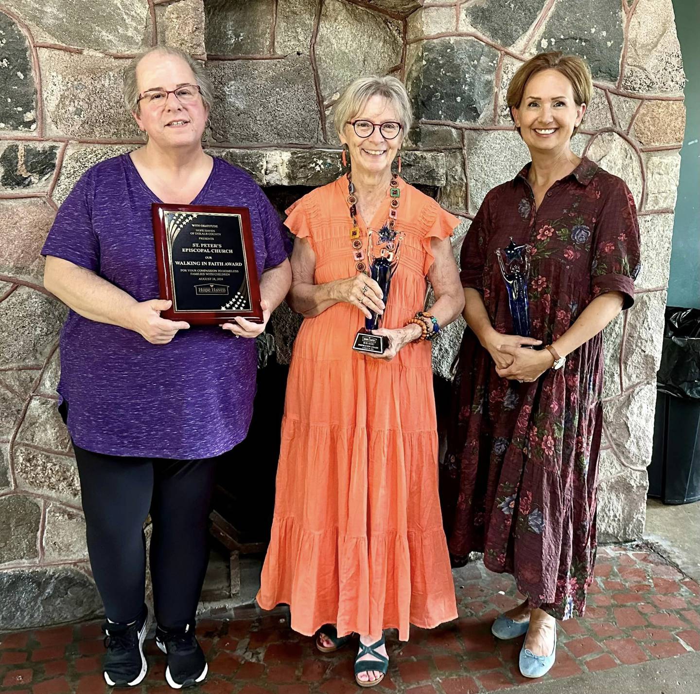 Hope Haven homeless shelter in DeKalb recognizes community partners in this photo. Pictured is Lori Brown who earned the Outstanding Volunteer Award; Sue Guio who earned the Inspiration Award and a representative from St. Peter’s Episcopal Church who given the Walking in Faith Award.