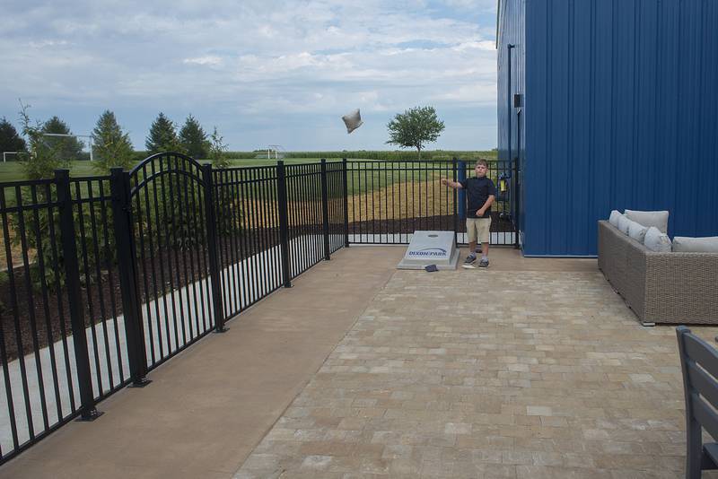 Logan Sholders, 12, tosses a bag while trying out the new permanent corn hole game at Dixon Park District's Facility Friday, August 19, 2022.