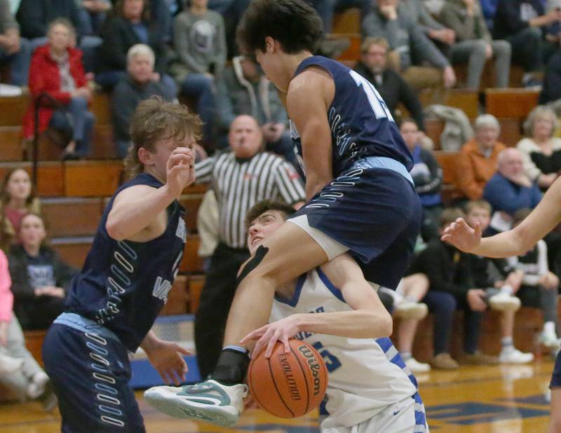 Bureau Valley's Corban Chhim draws a foul on Princeton's Landen Koning on Tuesday, Jan. 30, 2024 at Princeton High School.