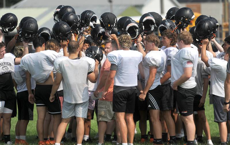 After not being able to field a varsity football team last year, head coach Kris Cassie (center) has started summer workouts with this year's football team at Sandwich High School on Monday, July 17, 2023.