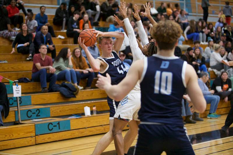 Downer's Grove South's Justin Sveiteris looks for help as Willowbrook's double  defense on Friday, Feb.2,2024 in Villa Park.