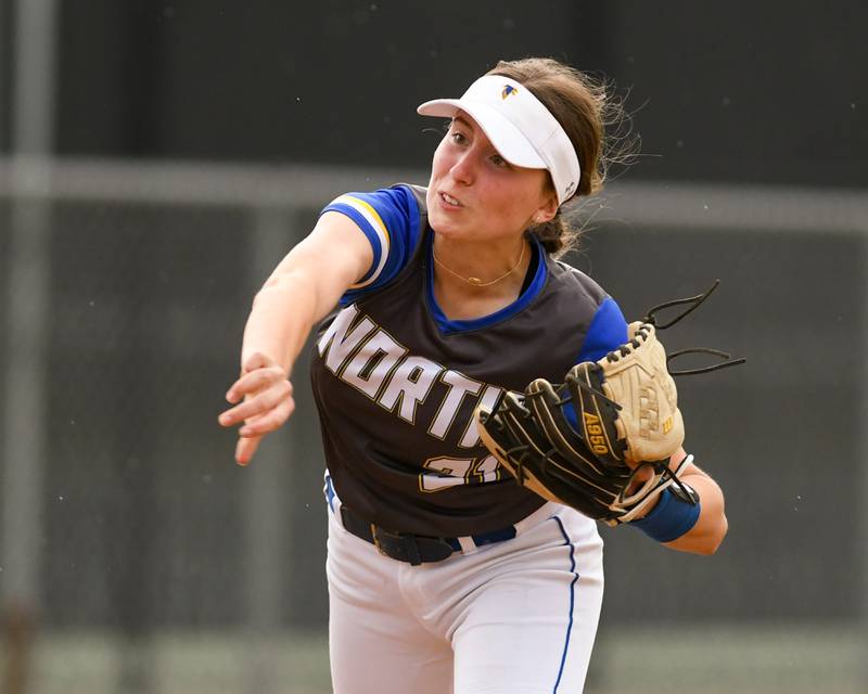 Wheaton North's Reagan Crosthwaite (21) throws out a Glenbard North runner at first base during the game on Monday May 13, 2024, held at Wheaton North High School.