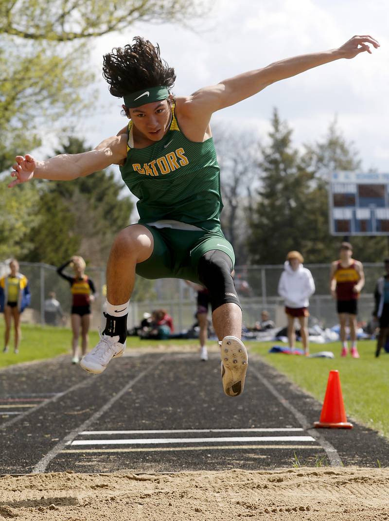 Crystal Lake South’s joey Wolt competes in the long jump Friday, April 21, 2023, during the McHenry County Track and Field Meet at Cary-Grove High School.