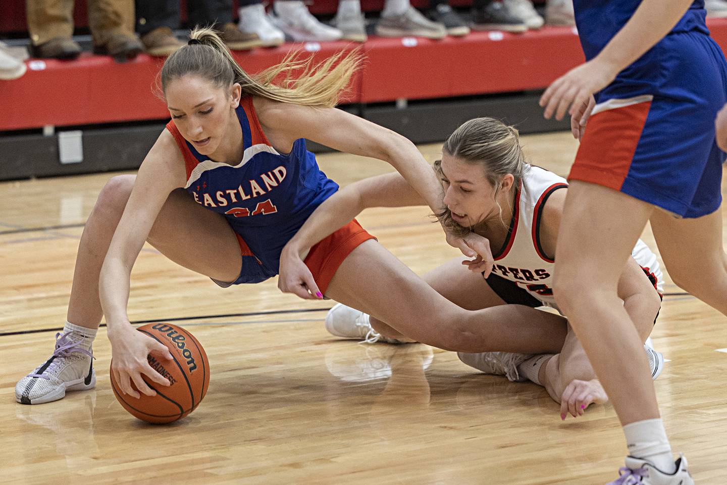 Eastland’s Trixie Carroll and Amboy’s Maeve Larson fights for a loose ball Friday, Jan. 19, 2024 at Amboy High School.