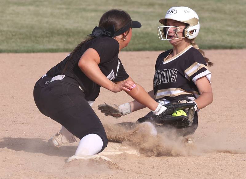 Sycamore's Annabella Johnson is tagged out by Prairie Ridge's Mary Myers at second during their Class 3A sectional final Friday, May 31, 2024, at Sycamore High School.