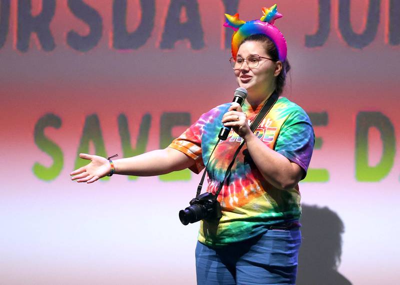 Beth Ganion, prevention and communications manager with Safe Passage, speaks in the auditorium Thursday, June 20, 2024, during DeKalb Pride Fest at the Egyptian Theatre.