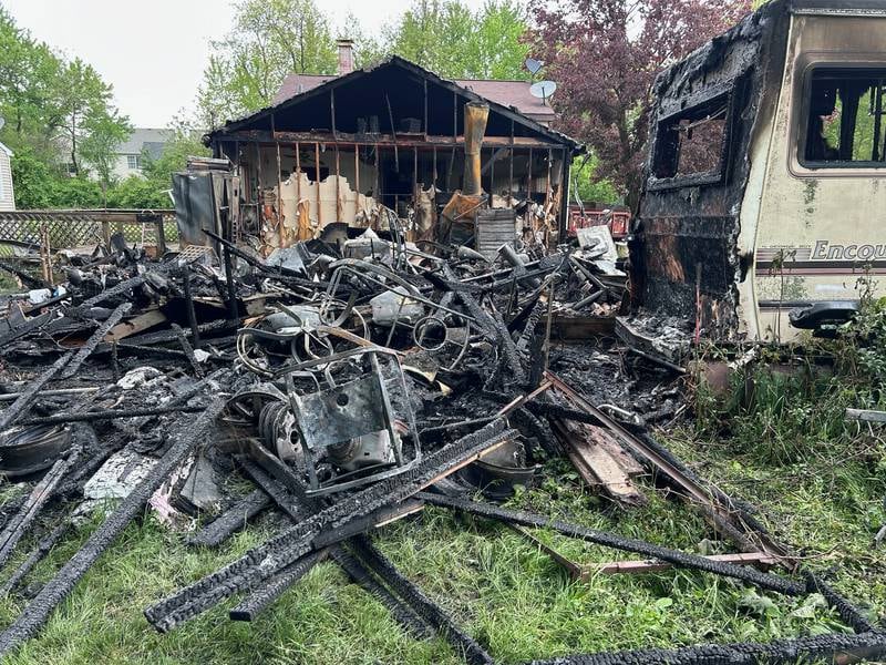 An attached garage, including several motorcycles and propane tanks stored inside it and an RV parked next to it, burned on Tuesday, May 7, in Wonder Lake. The Wonder Lake Fire Protection District responded to the blaze, which officials believe may have been caused by a lightning hit.
