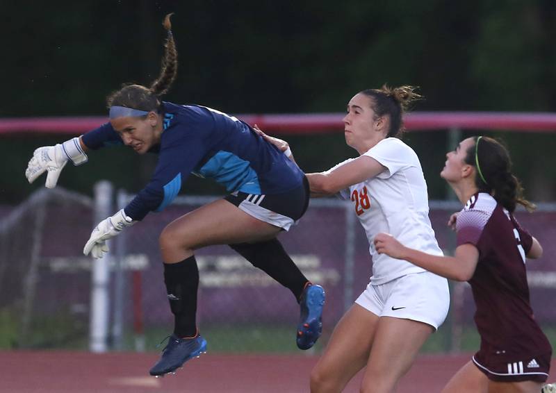 St. Ignatius College Prep's MC Galante collides with Crystal Lake Central's Jillian Mueller during the Class 2A Deerfield Supersectional girls soccer match on Tuesday, May 28, 2024, at Deerfield High School.