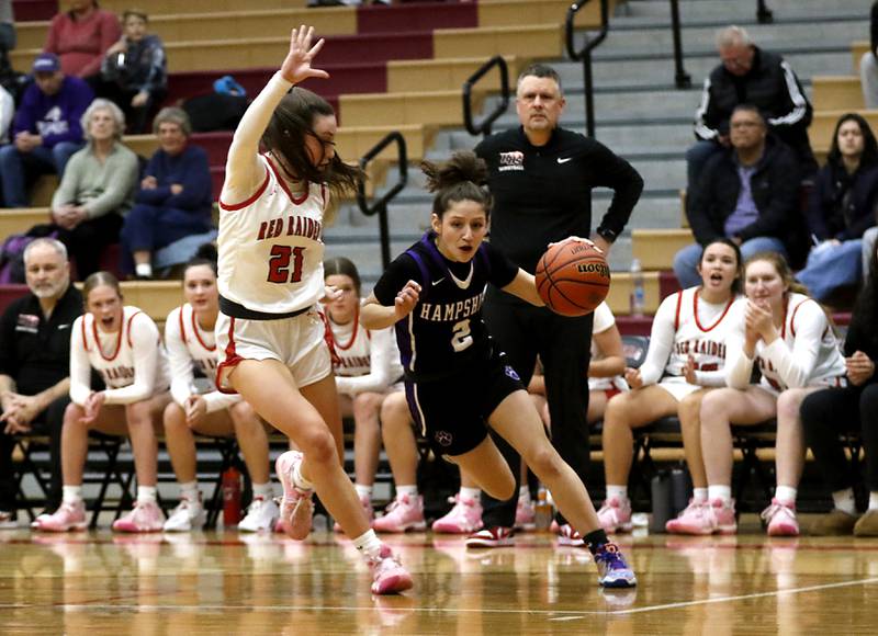 Hampshire's Alex Montez drives the bailing against Huntley's Samantha Campanelli during a Fox Valley Conference girls basketball game Monday, Jan. 30, 2023, at Huntley High School.