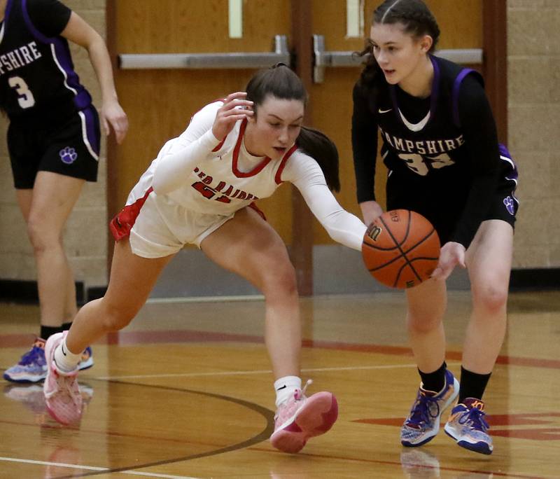 Huntley's Samantha Campanelli tries to steal the ball from Hampshire's Ashley Herzing during a Fox Valley Conference girls basketball game Monday, Jan. 30, 2023, at Huntley High School.