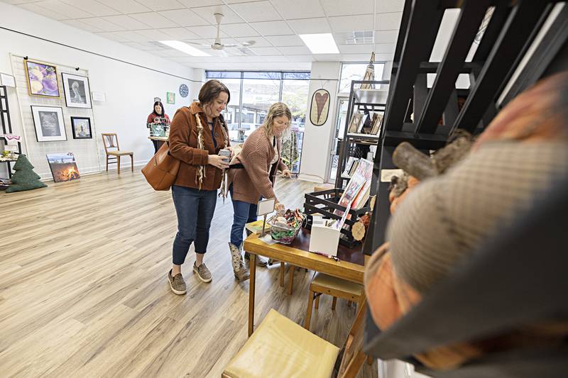 Tina Rockwell (left) and Lindsey Regain look over items in new downtown Dixon store “From My Corner” Thursday, Oct. 12, 2023. The arts store just recently opened at 115 S. Hennepin Ave. in Dixon. The business was holding a soft opening during Discover Dixon’s Witches Night Out.