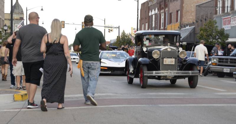 Thousands walk along Main St in Streator viewing as they drive by during The Dream Machine Car Clubs Cruise night Saturday.