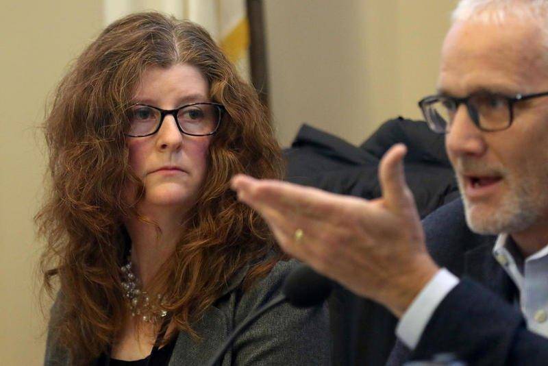 McHenry County Department of Health Administrator Melissa Adamson listens as Illinois Credit Union League President Tom Kane speaks during a town hall Jan. 22 in Algonquin about the government shutdown.