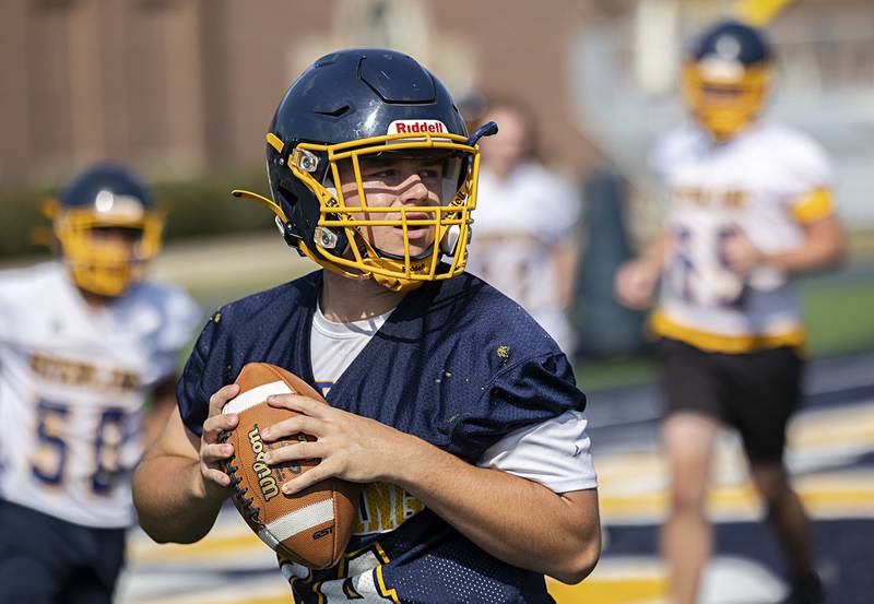 Sterling’s Drew Nettleton works on his footwork Tuesday, Aug. 13, 2024 during QB drills at Sterling High School.