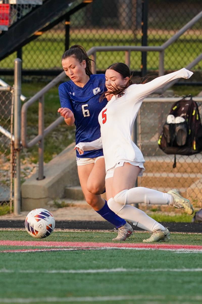 Geneva’s Margaret Anderson (6) challenges Glenbard East's Jamie Quirk (5) for the ball during a Class 3A Glenbard East Regional semifinal soccer match at Glenbard East High School in Lombard on Tuesday, May 14, 2024.