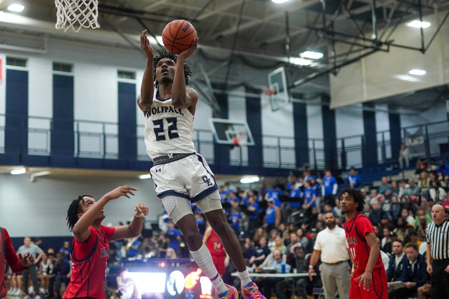 Oswego East's Jehvion Starwood (22) drives to the hoop against West Aurora during a basketball game at Oswego East High School.