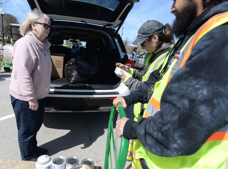 Jerra Haagar of Westmont gets assistance from Flat Can Regional Manager Amy Dabe and Recycling Assistant Carlos Rugerio during the Electronics and More Recycling event held in Westmont Saturday, April 6, 2024.