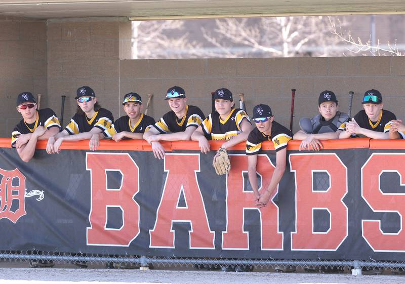 The Metea Valley bench watches their team bat during the game against DeKalb Thursday, April 13, 2023, at DeKalb High School.