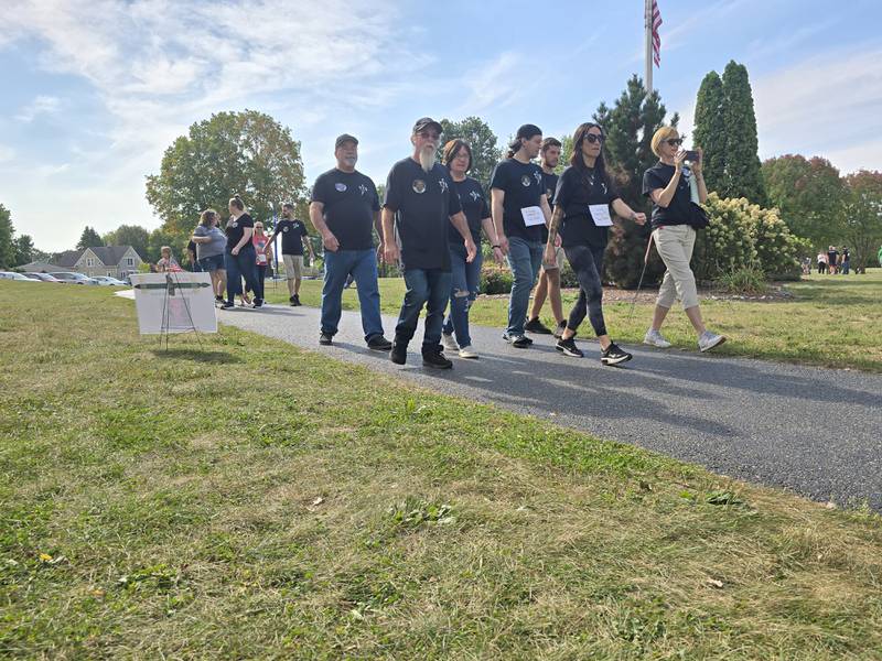 Walkers participate Sunday, Sept. 15, 2024, at the Compassionate Friends Walk to Remember at Baker Lake in Peru.