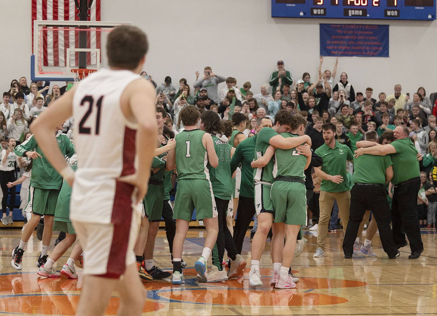 The Scales Mound Hornets celebrate a 50-46 win over the Fulton Steamers Friday, March 3, 2023 in the 1A sectional final in Lanark.