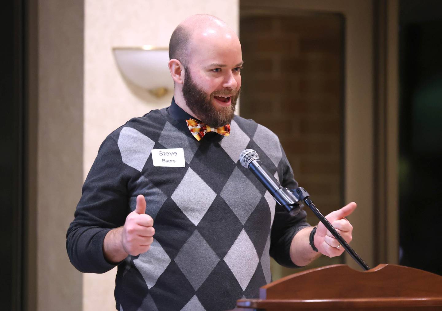 Steve Byers, co-owner of Byers Brewing Company, gives a thumbs up after being awarded the 2022 Business of the Year Thursday, Feb. 9, 2023, during the DeKalb Chamber of Commerce’s Annual Celebration Dinner in the Barsema Alumni and Visitors Center at Northern Illinois University.