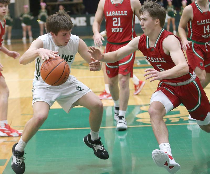 St. Bede's Alex Ankiewcz dribbles in the lane as L-P's Seth Adams defends on Wednesday, Feb. 14, 2024 at St. Bede Academy.
