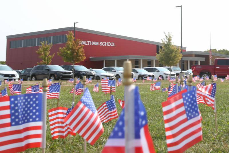 Waltham School placed 2,977 flags outside the school lawn to remember the lives lost in the 9/11 attacks on Monday, Sept. 11, 2023 in Utica.