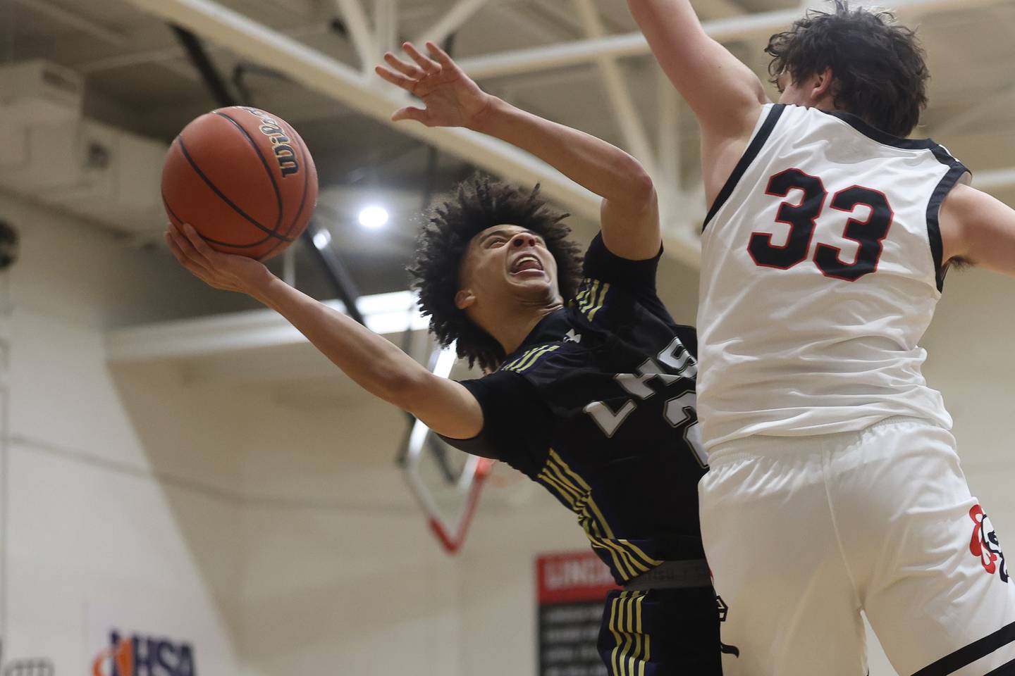 Lemont’s Ryan Runaas finesse a shot against Lincoln-Way Central on Wednesday, Jan. 10th, 2024 in New Lenox.