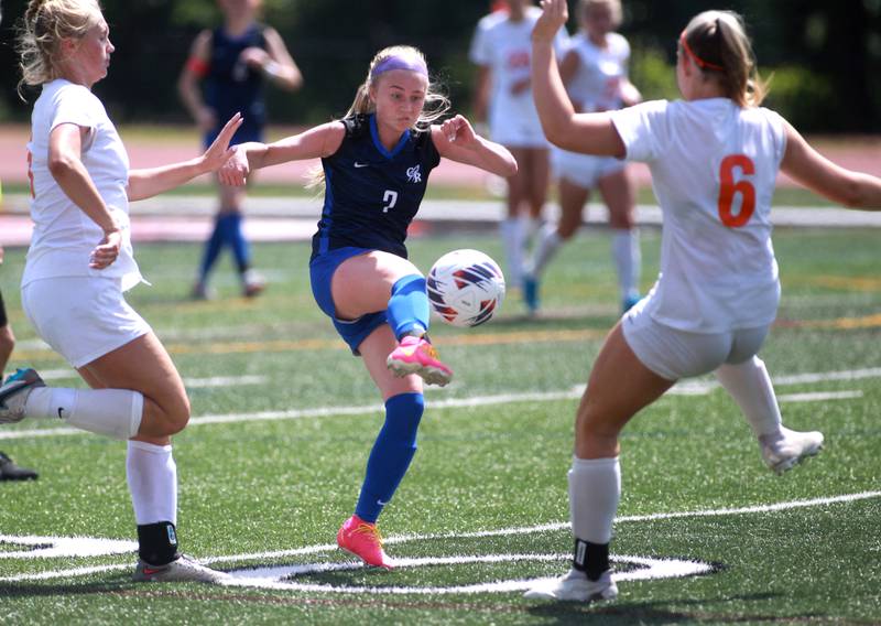 Burlington Central’s Ellie Elders (center) kicks the ball during the Class 2A state semifinal game against Crystal Lake Central at North Central College in Naperville on Friday, May 31, 2024.