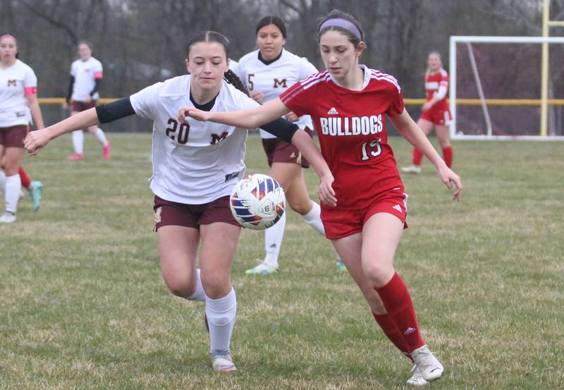 Morris's Nicolette Boelman and Streator's Audrey Armabula race toward the ball on Monday, March 25, 2024 at the James Street Recreation Area in Streator.