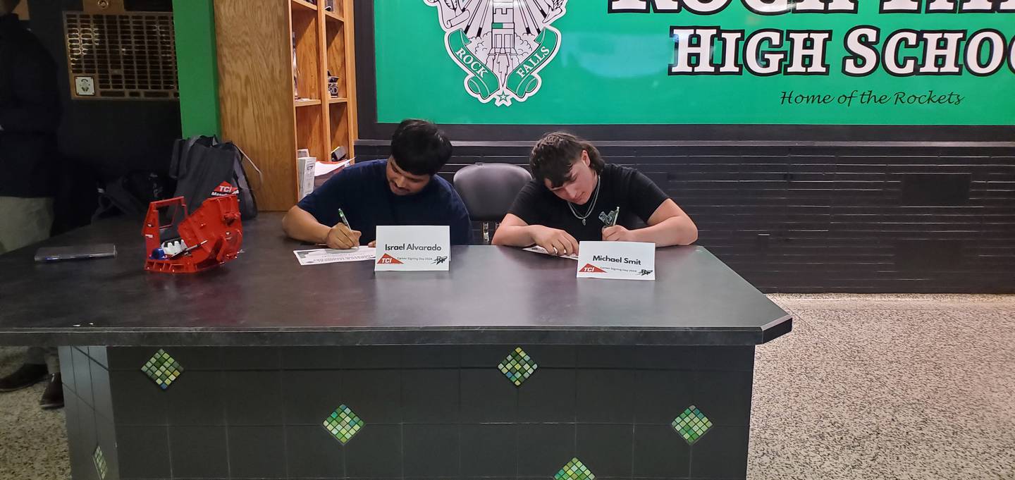 Israel Alvarado (Left) and Michael Smit (Right) sign with TCI Manufacturing in Walnut at Rock Falls High School during "signing day" on Friday, May 17.