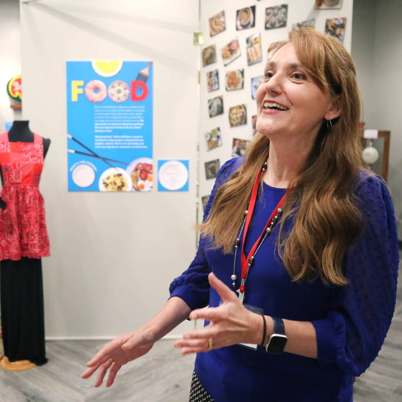 Michelle Donahoe, executive director of the DeKalb County History Center, talks Thursday, June 6, 2024, about the new exhibit “Food: Gathering Around the Table,” now open at the center in Sycamore. The exhibit was created by the DeKalb County History Center in collaboration with the Smithsonian Institution's Museum on Main Street program.