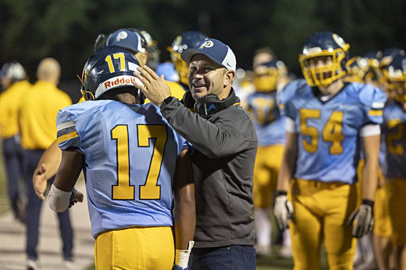 Sterling coach Jon Schlemmer celebrates Sterling’s Kaedon Phillips TD catch against Galesburg during the 2023 season at Sterling High School.