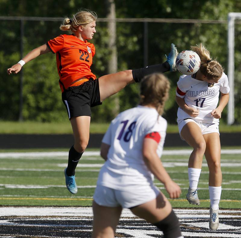 Crystal Lake Central's Olivia Anderson tries to kick the ball away from Wauconda's Ava Hortillosa during the IHSA Class 2A Grayslake North Regional championship soccer match on Friday, May 17, 2024, at Grayslake North High School. Anderson received a yellow card on the play.