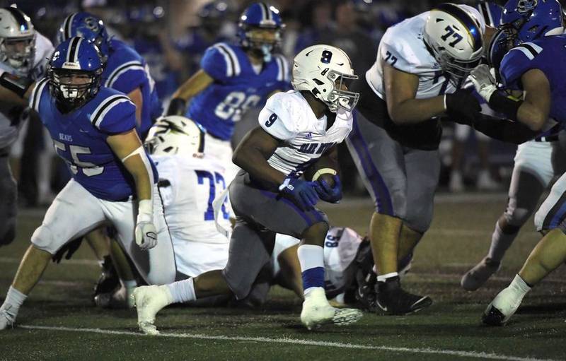 Warren's Aaron Stewart runs against Lake Zurich in a football game in Lake Zurich on Friday, September 22, 2023