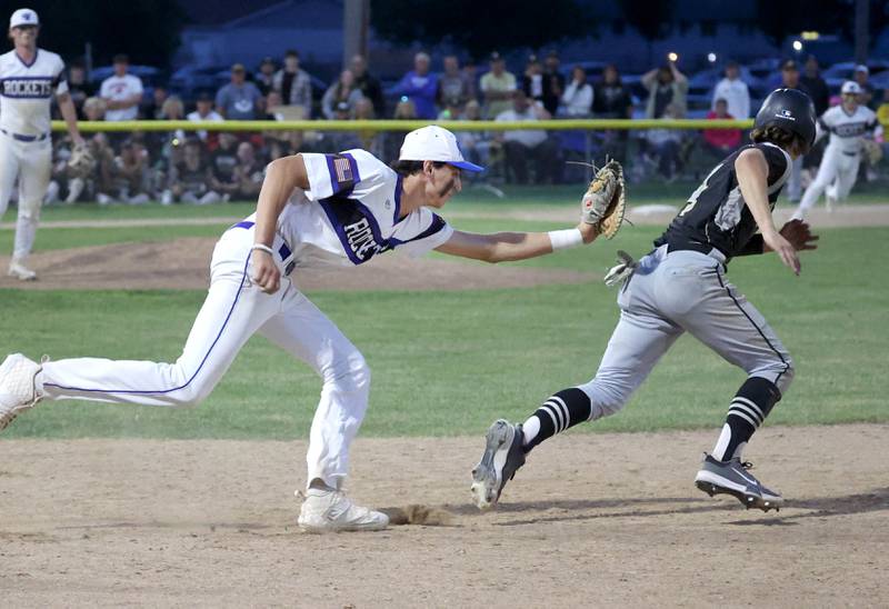 Burlington Central's Andrew Payton tags out Sycamore's Collin Severson during the Class 3A sectional final game Friday, May 31, 2024, at the Sycamore Community Sports Complex.