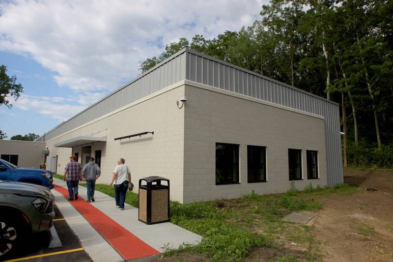 People arrive for an open house at The McHenry County Regional Training Center in Cary Tuesday evening.