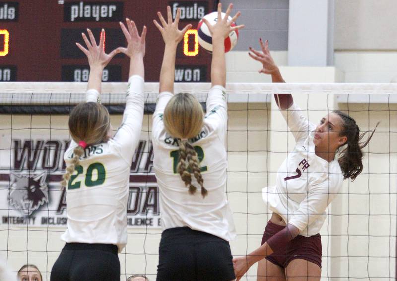 Prairie Ridge’s Maizy Agnello, right, sends the ball over the net against Crystal Lake South in varsity girls volleyball on Thursday, Aug. 29, 2024, at Prairie Ridge High School in Crystal Lake.