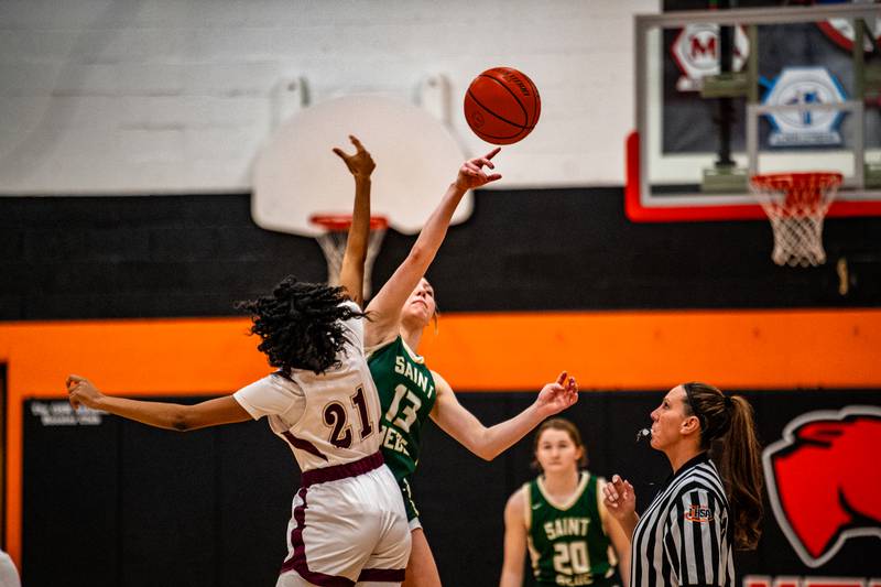 St. Bede's Ashlyn Ehm wins the tip off against Morgan Park's Tiara Williams During the 1A Sectional game on Tuesday Feb. 20, 2024 at Gardner-South Wilmington High School in Gardner