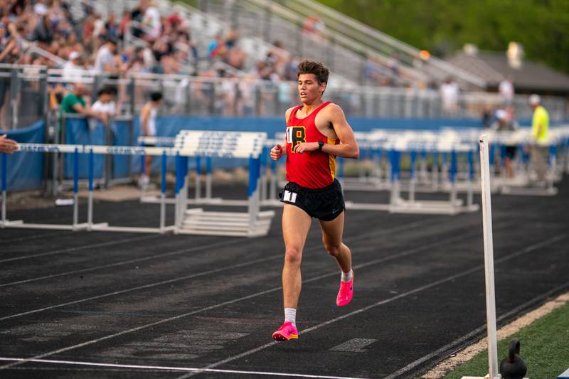 Batavia’s Quintin Lowe wins the 3200 meter run during a DuKane Conference boys track and field meet at Geneva High School on Thursday, May 11, 2023.