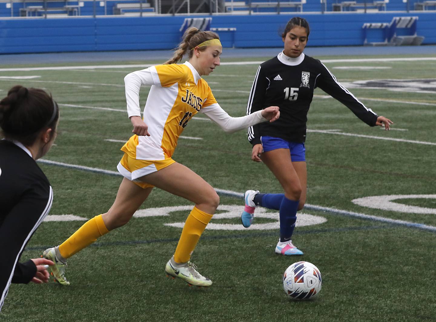 Jacobs' Gabby Wojtarowicz tries to control the ball in front of Lake Zurich’s Sam Romero during a 2023 nonconference girls soccer match at Lake Zurich High School.