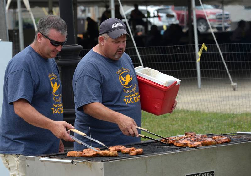 John Hopkins (left) and Chris Diehl were busy grilling pork chops at the Polo Snow Rangers food booth at Town & Country Days in Polo on Saturday, June 15, 2024.