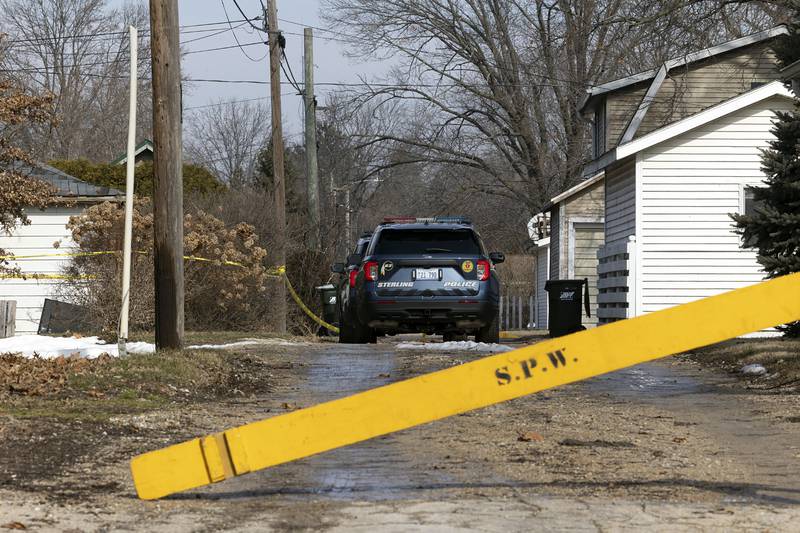 Investigators work at the scene Monday, Feb. 20, 2023 of a Sunday night shooting in the 1100 block of 4th Ave. in Sterling. One victim was pronounced dead with four taken into custody.