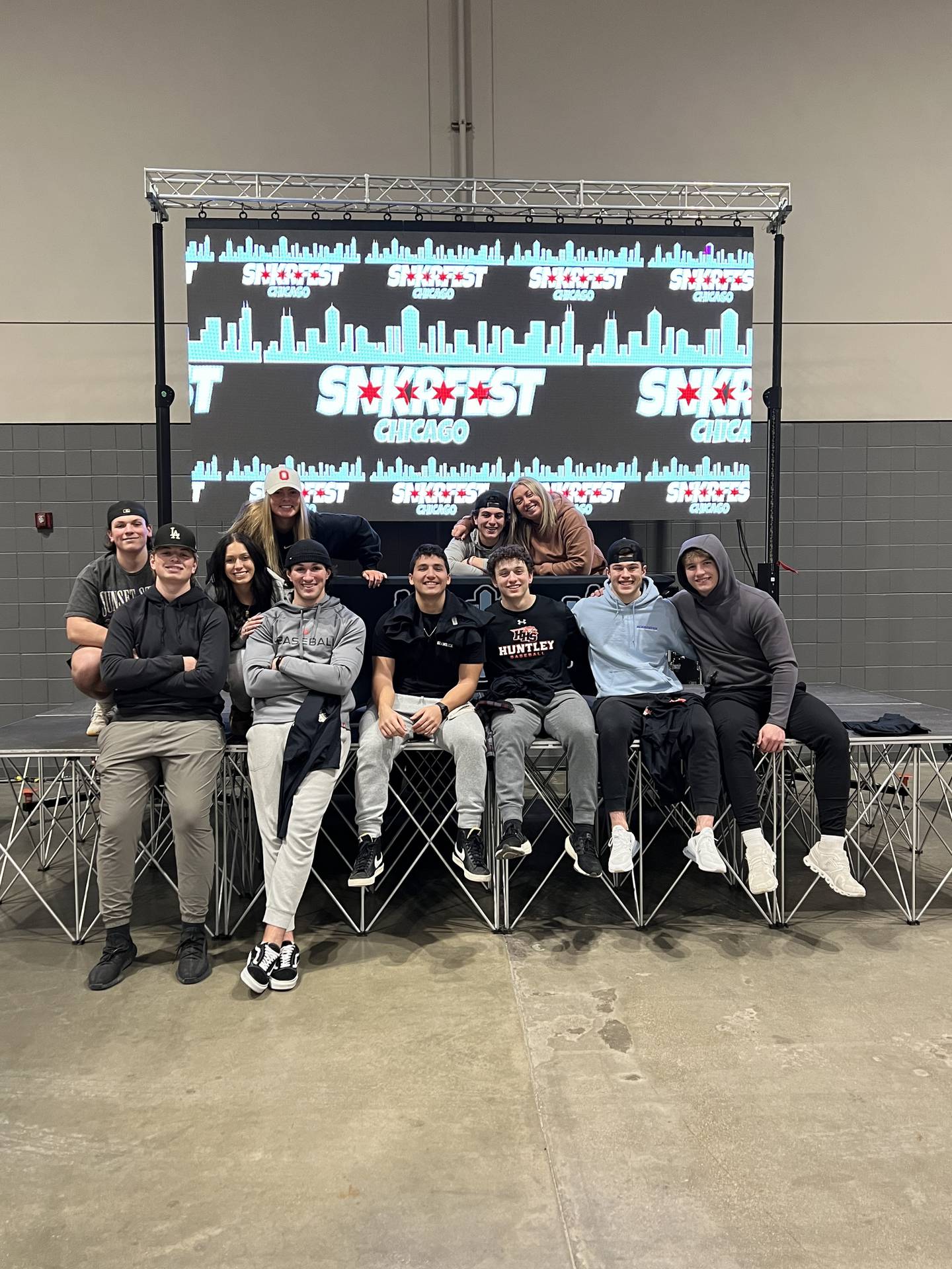 The SnkrFest Chicago team takes a break during the May 7, 2023, SnkrFest at the Schaumburg Convention Center. Photo provided by Parker Schuring