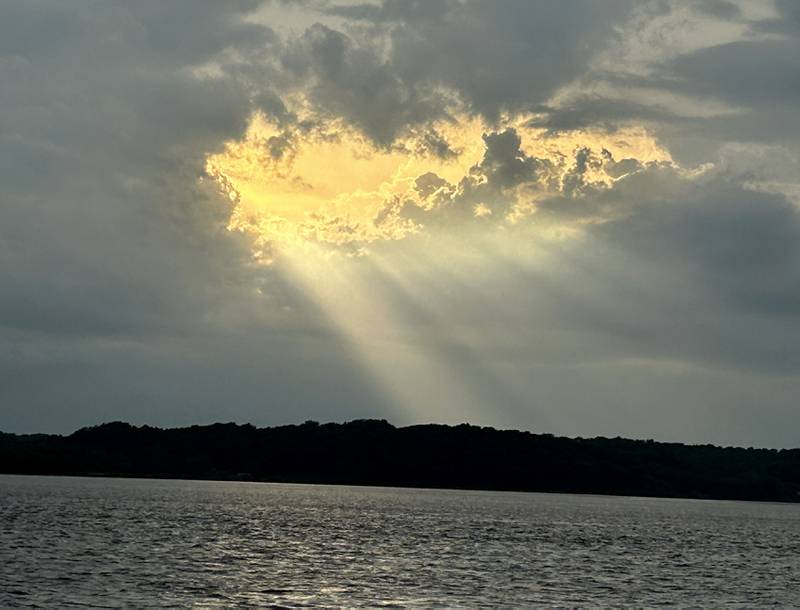Sun rays shine through storm clouds over the Mississippi River near Lock & Dam 13, north of Fulton on Saturday, June 22,. 2024.. The storms brought several inches of rain to counties in nothwestern Illinois later in the evening.